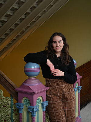 Iakoiehwahtha (Iako) Patton standing in a stairwell. 