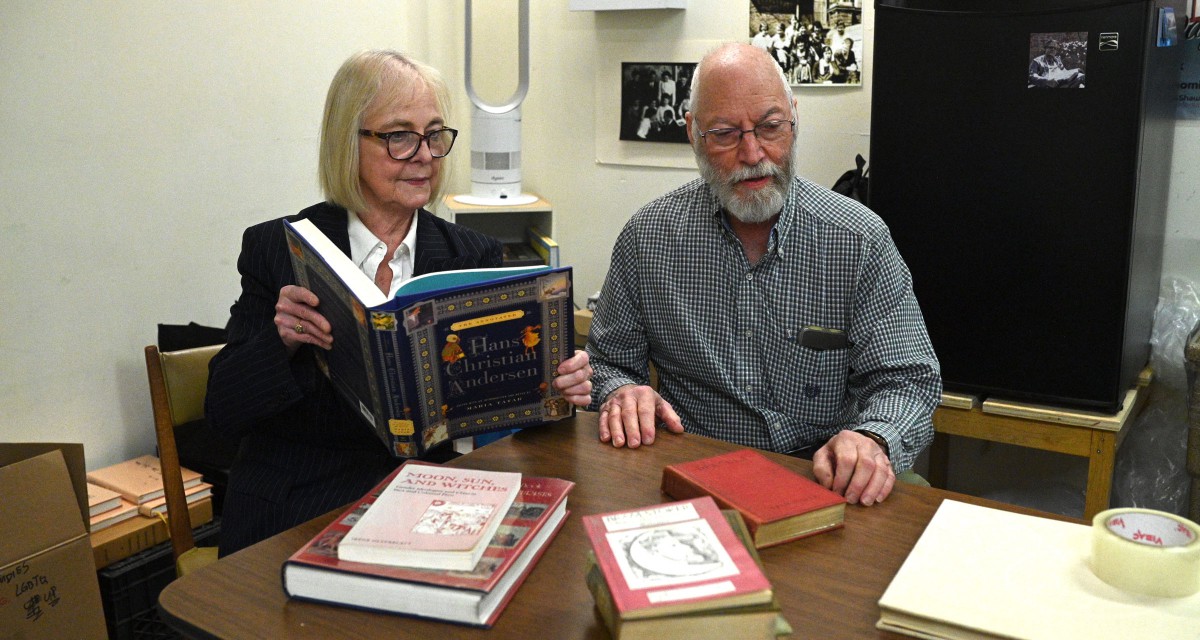 Nancy Ruhnke and Dr. Robert C. Brandeis examine recent donations to the Victoria College Book Sale.